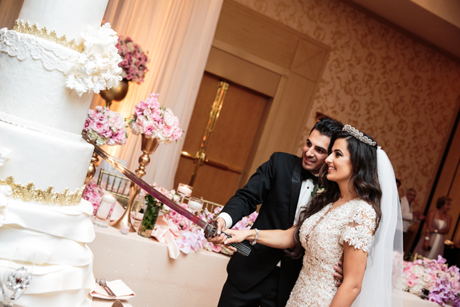 Ishtar and Lawrence cutting the cake
